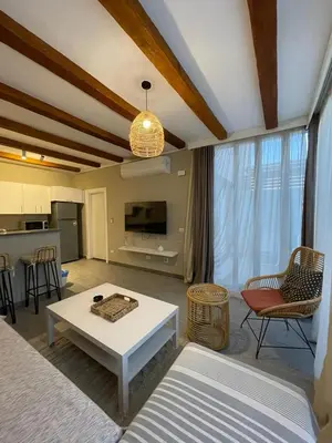a living room with a couch and a table at one bedroom in gouna in Hurghada