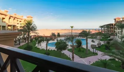 a view from the balcony of a resort at Resort-Style Luxury Chalet with Pool and Sea View in Sahl Hasheesh in Hurghada