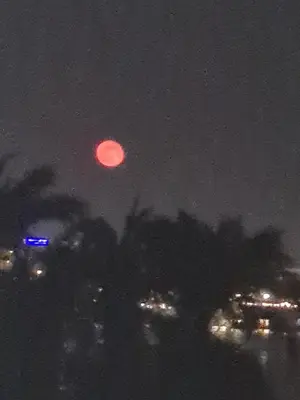 a red moon in the sky at night at Tut in Luxor