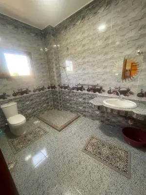 a bathroom with a toilet and a sink at Flat in Kom in Luxor
