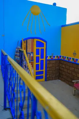 a blue room with a phone booth on the wall at Nubiano Cataract in Shellal