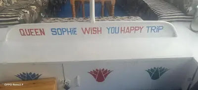 a sign on a boat that reads queen spitfire wish you happy rip at Queen Sophie in Luxor