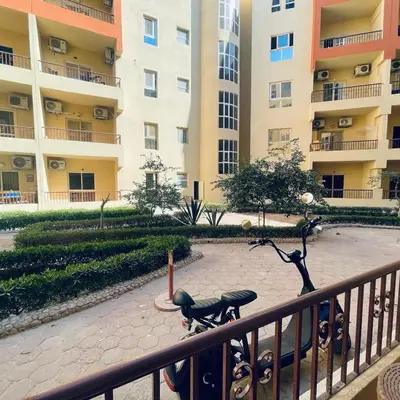 a statue in front of a large apartment building at 1 plus 1 in city centre Hurghada in Hurghada