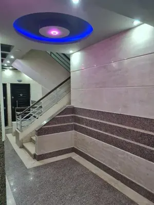 a blue frisbee flying over a staircase in a building at El Hadaba behind Raya in Hurghada