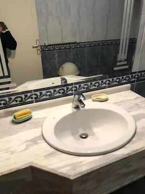 a bathroom counter with a sink and a mirror at Apartment sea view in Hurghada