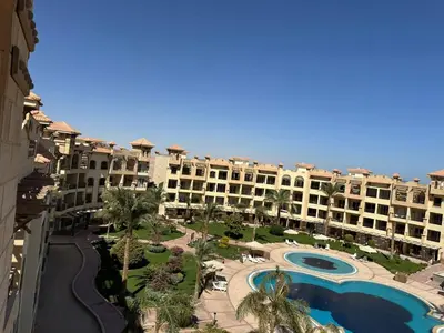an aerial view of a resort with a swimming pool at Luxury Sea View Studio at Alsaraya Resort Your Ultimate Sahl Hasheesh Getaway in Hurghada