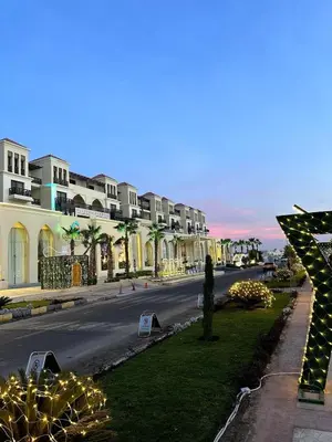 a street with christmas lights on the side of the road at studio in a 5 star hotel in Hurghada