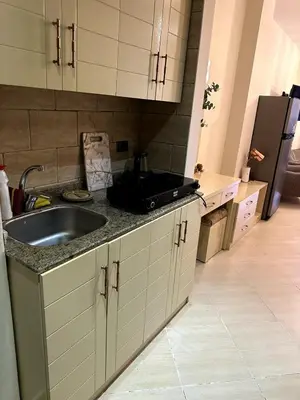 a kitchen with a sink and a refrigerator at studio in a 5 star hotel in Hurghada