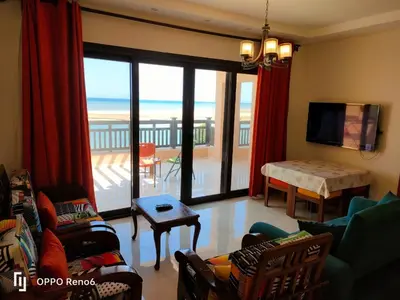 a living room with a view of the ocean at Luxury 2 bedroom in fandir el gouna in Hurghada