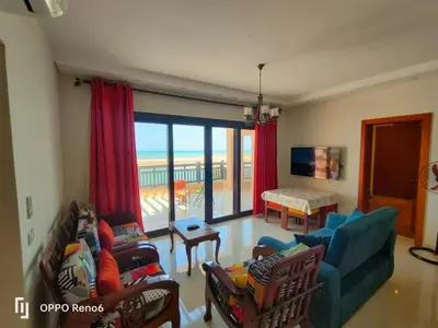 a living room with a view of the ocean at Luxury 2 bedroom in fandir el gouna in Hurghada