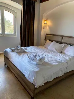 a bed with two bowls on top of it at Luxury villa west golf in Hurghada