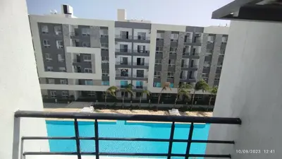 a view of a building from a balcony at Fanadir Bay Resort in Hurghada