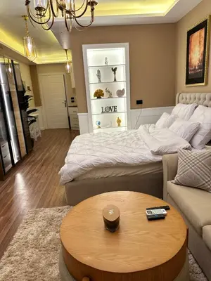 a living room with a bed and a coffee table at The best Studio in Hurghada