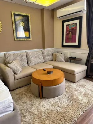 a living room with a couch and a coffee table at The best Studio in Hurghada