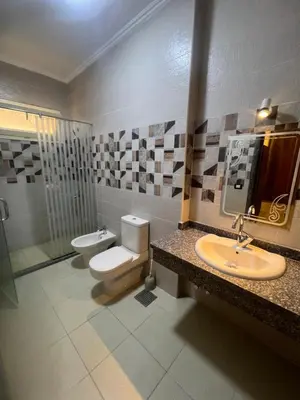 a bathroom with a toilet and a sink and a shower at Sky star 135 in Hurghada