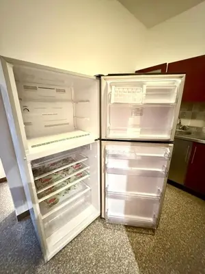 a refrigerator with its door open in a kitchen at Amazing 2BR Apartment - Al Dora Resort, Hurghada in Hurghada