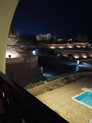 a view of a river at night with a bridge at The View in Hurghada