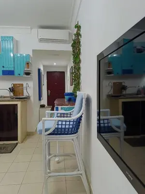a blue and white chair in a kitchen at The View in Hurghada