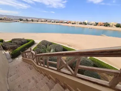 a balcony with a view of a beach and a body of water at Sabina Y97- 23 in Hurghada
