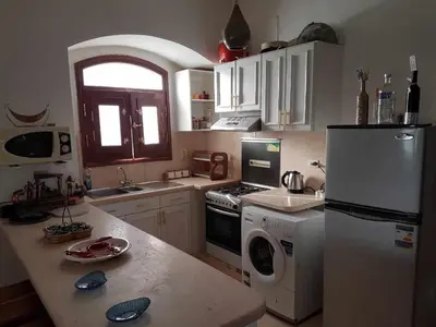 a kitchen with a refrigerator and a washer and dryer at Sabina Y97- 23 in Hurghada