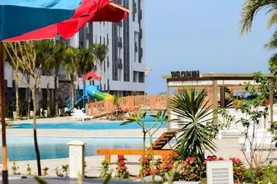 a swimming pool with a playground in a city at Fanadir Bay Resort in Hurghada