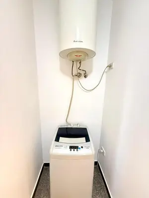 a stove in a room with a light on the wall at Stunning 2BR Apartment - Al Dora Resort, Hurghada in Hurghada