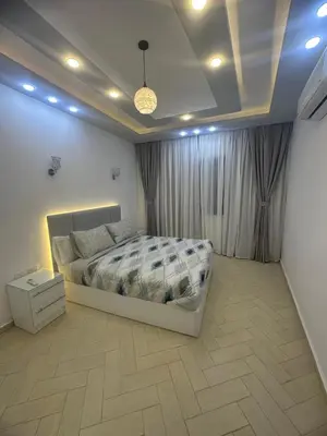 a bedroom with a bed in a room at Al Saraya Sahl Hashish Serenity Chalet in Hurghada