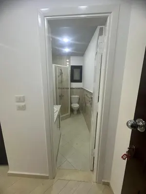 a bathroom with a shower and a toilet in it at Al Saraya Sahl Hashish Serenity Chalet in Hurghada
