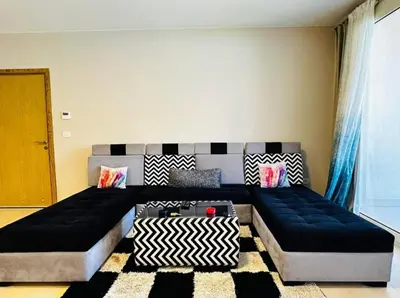 a living room with two beds and a couch at One bedroom in gouna in Hurghada