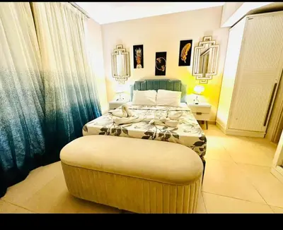 a bedroom with a large bed with a large ottoman at One bedroom in gouna in Hurghada