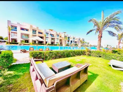 a view of a resort with a pool and lawnitures at One bedroom in gouna in Hurghada