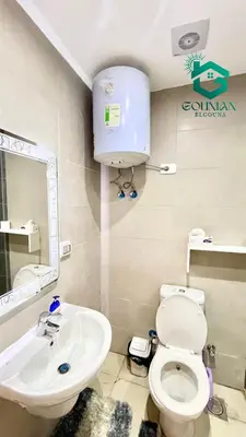 a bathroom with a toilet and a sink at Cozy studio G-cribs in Hurghada