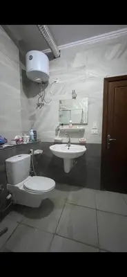 a bathroom with a toilet and a sink at GZ Resort in Hurghada