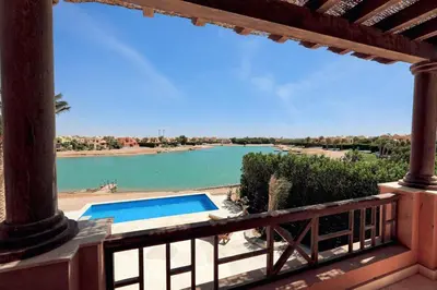 a view from the balcony of a house with a swimming pool at Villa 3bedroom in new years in Hurghada