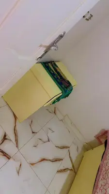 a shelf in a room with papers on the ceiling at waleed home in Jazīrat Aswān