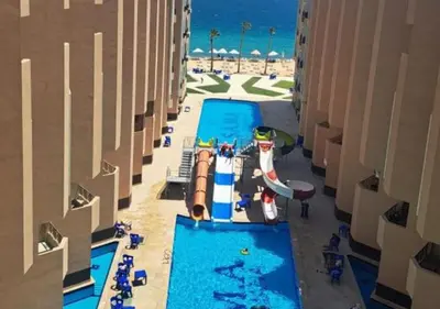 a pool at a resort with a water park at Juliana beach resort in Hurghada