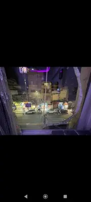 a view of a city street at night at City center NewAswan in Aswan
