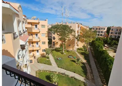 a view from the balcony of a building at Aton Apartment, Luxor Resort, Minutes from City Center in Luxor