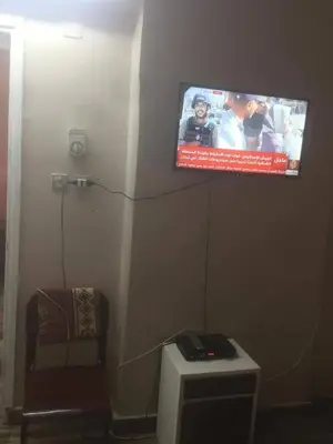 a flat screen tv hanging on a wall at اسوان كسر الحجر وسط البلد in Aswan