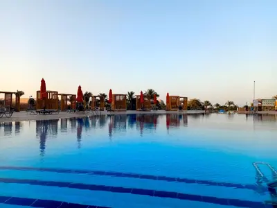 a large swimming pool with blue water at UTOPIA Blue Resort in Quseir