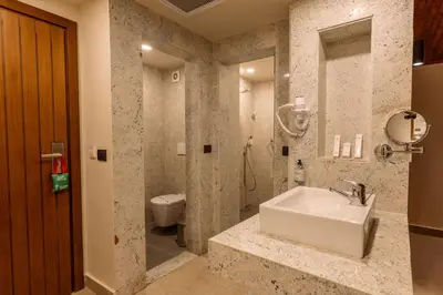 a bathroom with a sink and a toilet at UTOPIA Blue Resort in Quseir