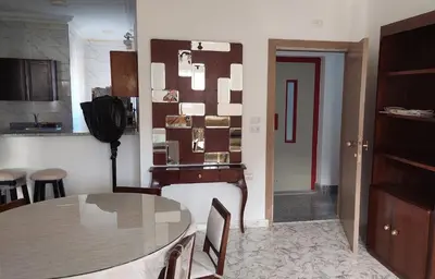 a kitchen with a table and a dining room at Hurghada Concierge at St Paul building 3 bd in Hurghada