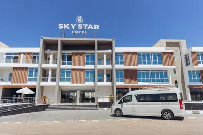 a white van parked in front of a building at Sky Star Hotel free shuttle to Hurghada City Center in Hurghada