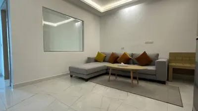 a living room with a couch and a table at Sky Star Hotel free shuttle to Hurghada City Center in Hurghada