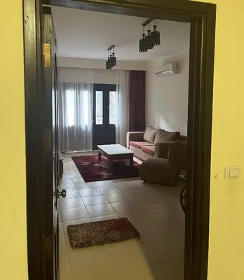 a living room with a couch and a table at Central Hurghada Apartment in Hurghada
