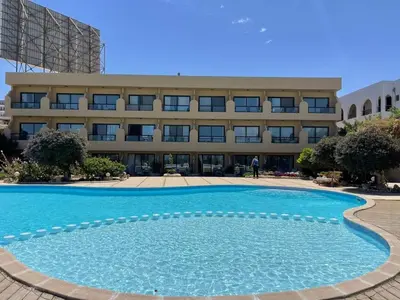 a large swimming pool in front of a building at Studio for rent 206 in Hurghada