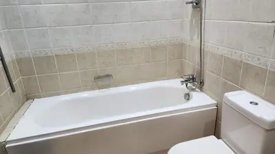 a bathroom with a white tub and a toilet at Studio for rent 206 in Hurghada