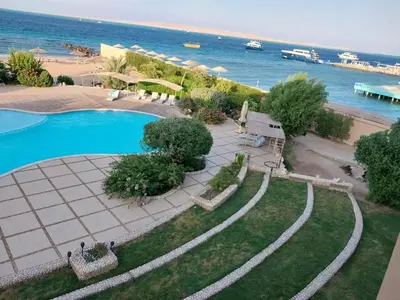 an aerial view of a swimming pool next to the beach at Studio for rent 206 in Hurghada