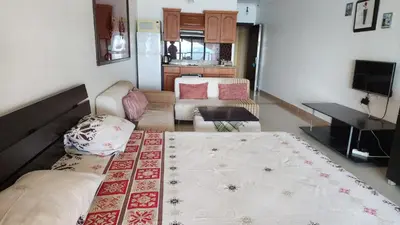 a living room with a bed and a couch at Studio for rent in the view 114 in Hurghada