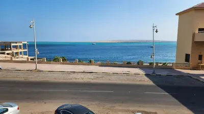 an empty street with a view of the ocean at Studio for rent in the view 114 in Hurghada